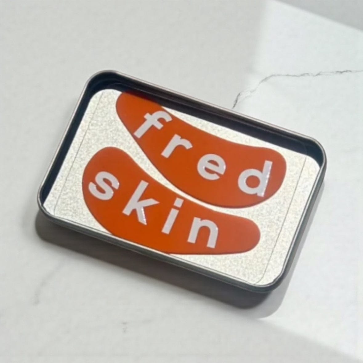 Fredskin Reusable Silicone Eye Mask - Green or Orange orange by Fredskin