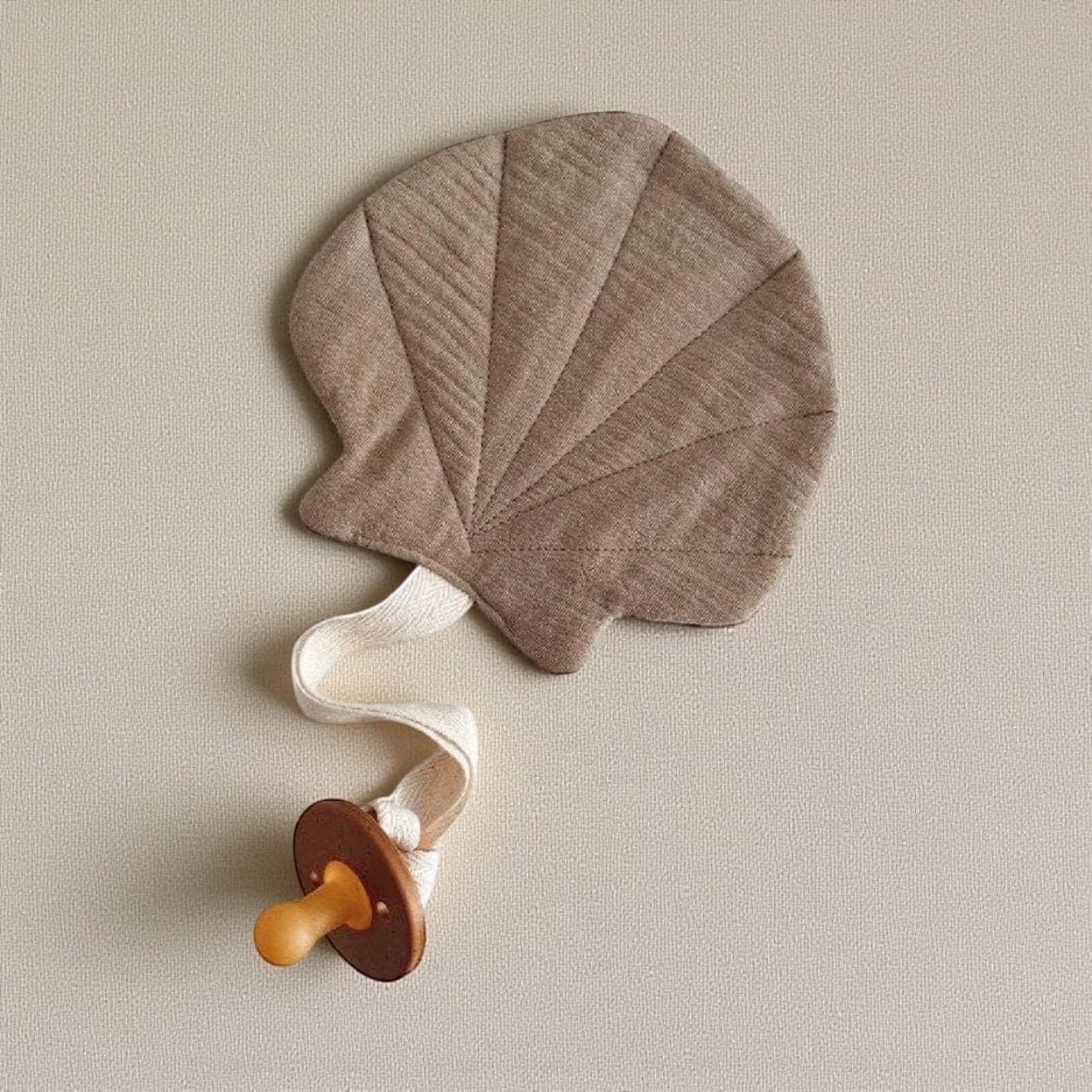 Lion + Lamb the Label Shell Dummy Holder in Blush and Taupe Taupe by Lion + Lamb the Label