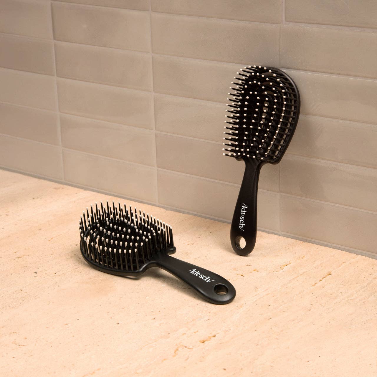 Mini Black Detangling Flexi Brush by KITSCH