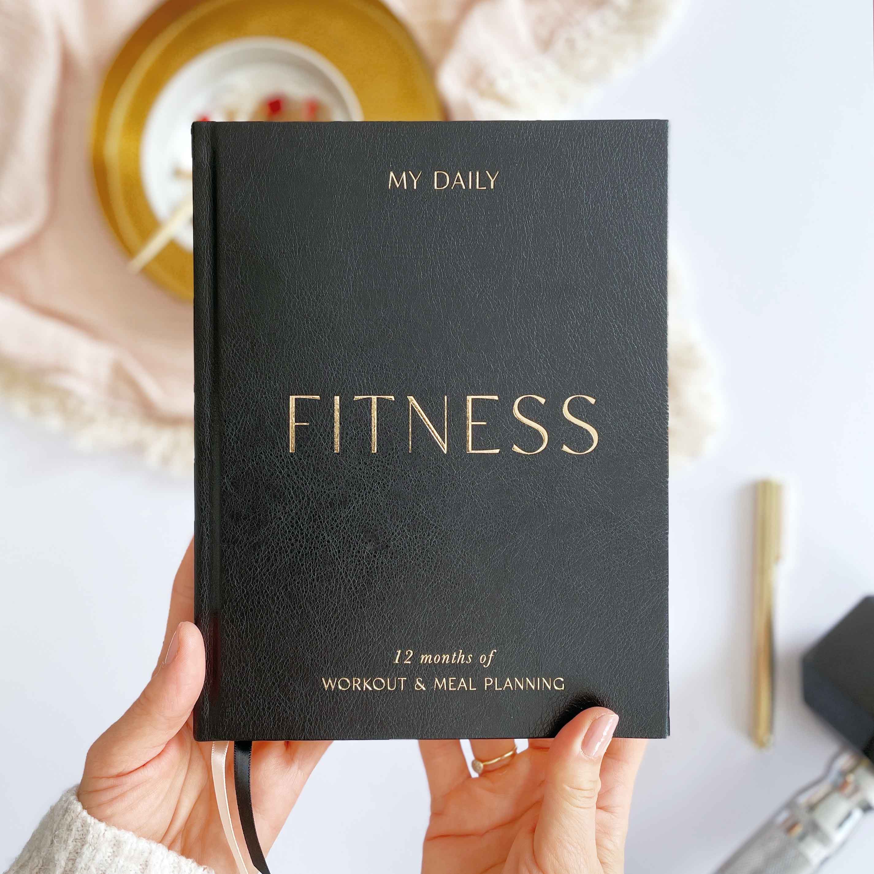 The Daily Fitness Planner - 365 Days of Movement, Meals & Motivation NEXT DROP MID JAN Black by Blush And Gold